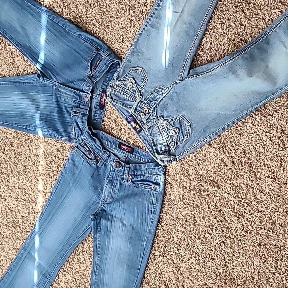 Angel jeans. Blue pinstripe are both same size 3 and 5. Other is 1